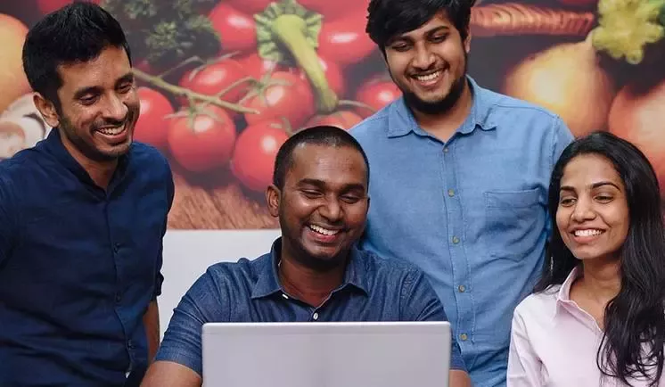 apprentice with colleagues