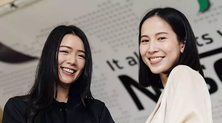 smiling students and graduates 